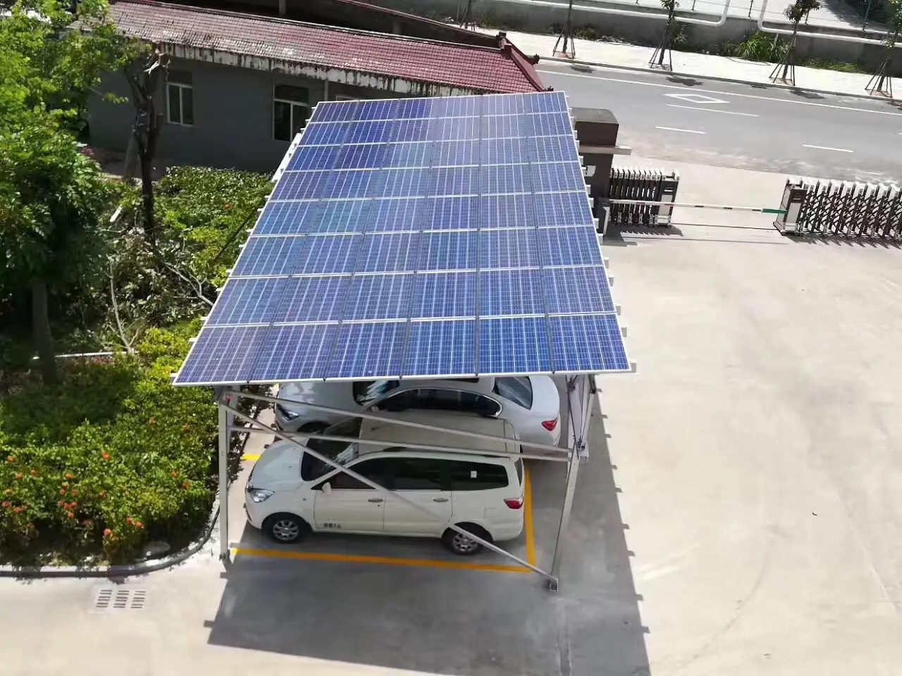 Solar canopy sheltering parked vehicles